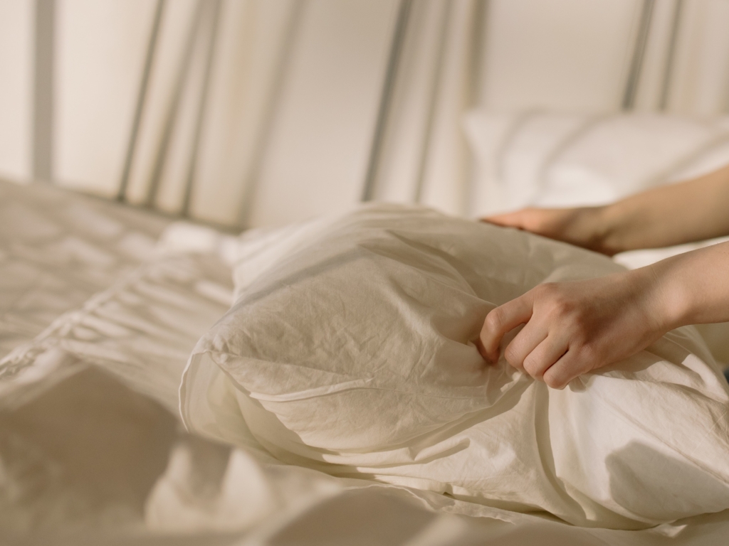 image of a person holding a pillow 